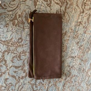 Dark brown leather clutch by Clare Vivier.